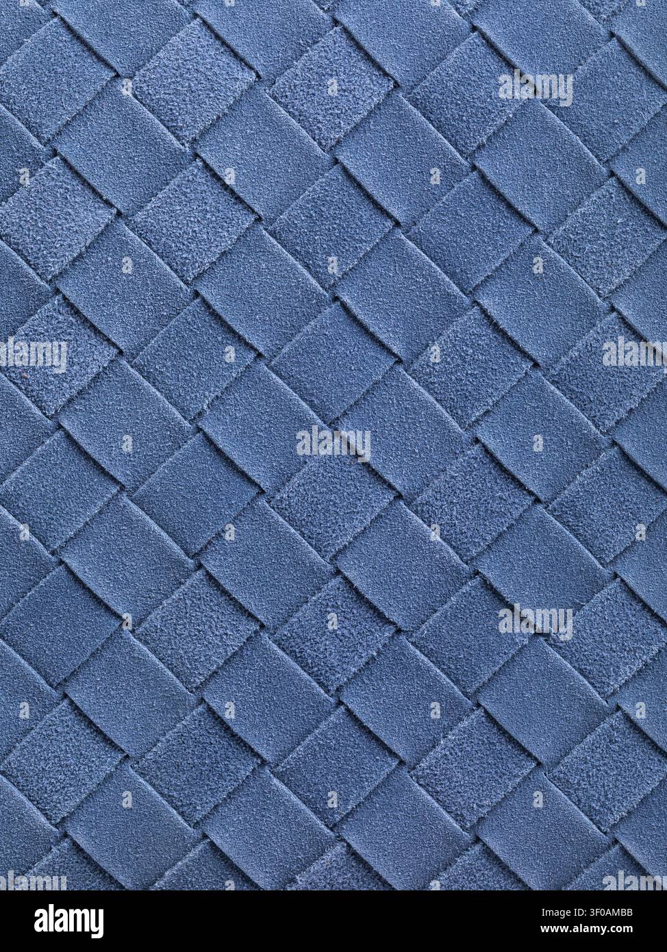 Woven blue suede leather texture background with diagonal interlaced pattern close-up Stock Photo