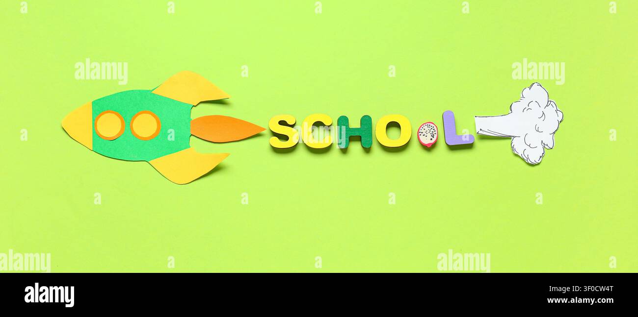 Paper rocket with school word on green background Stock Photo