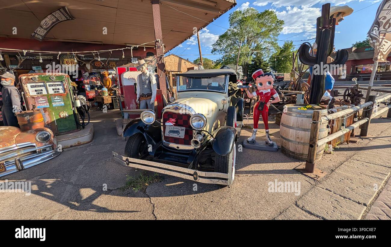 Antique items and memorabilia  from old business sites such as plastic statues and antique cars at an antique store in Williams, Arizona #3 - Smartphone Captured Stock Image