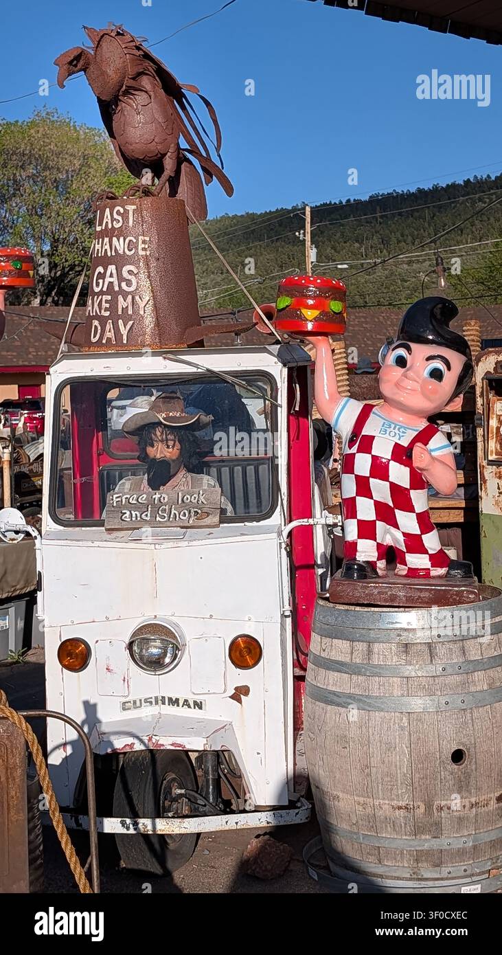 Antique items and memorabilia  from old business sites such as plastic statues and antique cars at an antique store in Williams, Arizona #2 - Smartphone Captured Stock Image