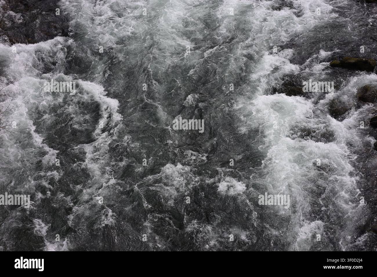 Overhead View of Rushing White Water Rapids and Troubled River Currents Stock Photo