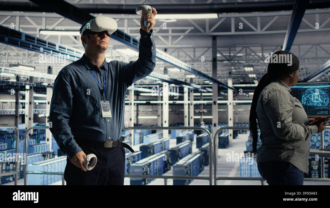 Programmer uses a VR headset in a server room to adjust AI systems and improve processing performance. Stock Photo