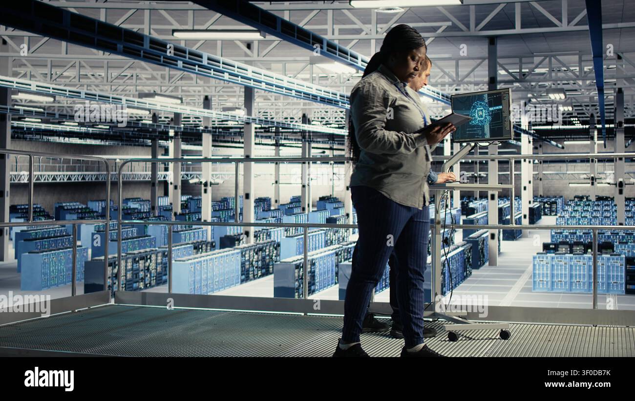 Server facility software developers roll out machine learning software on infrastructure racks. Stock Photo
