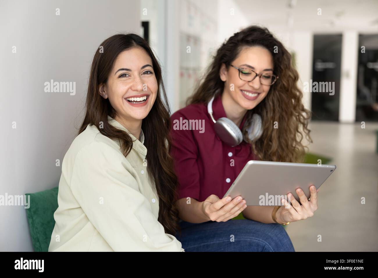 Colleagues collaborating on project, smiling, posing for professional portrait Stock Photo