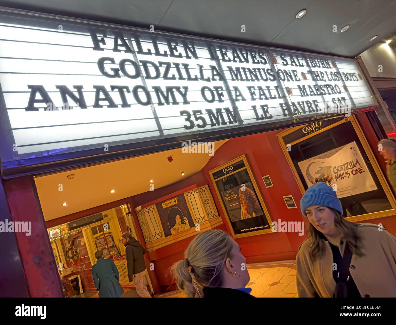 Cameo Cinema foyer in Tollcross, Edinburgh, Scotland, UK, with film listings for Anatomy of a Fall, Godzilla Minus One and Fallen Leaves. Stock Photo