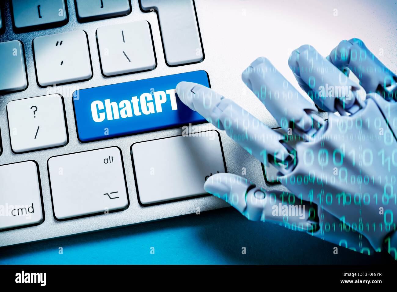 Robot hand with binary code presses key labeled ChatGPT on a computer keyboard, photomontage Stock Photo