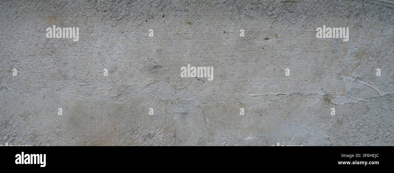 Horizontal close up of a concrete barrier block surface with a flat, uneven, rough unfinished cement texture Stock Photo