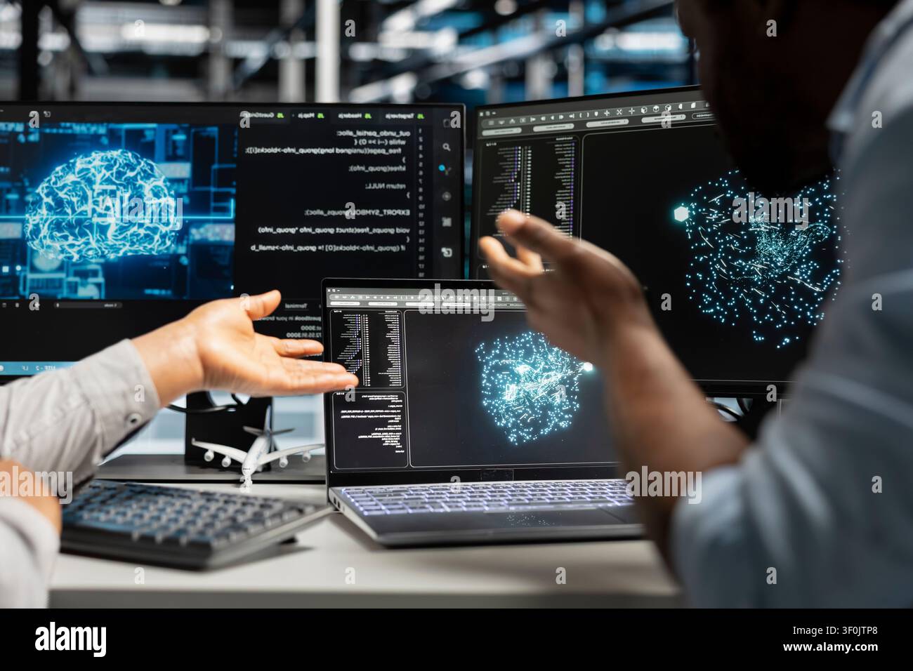 Data center engineering team reviews data analysis graph to reduce supercomputers failure. Stock Photo