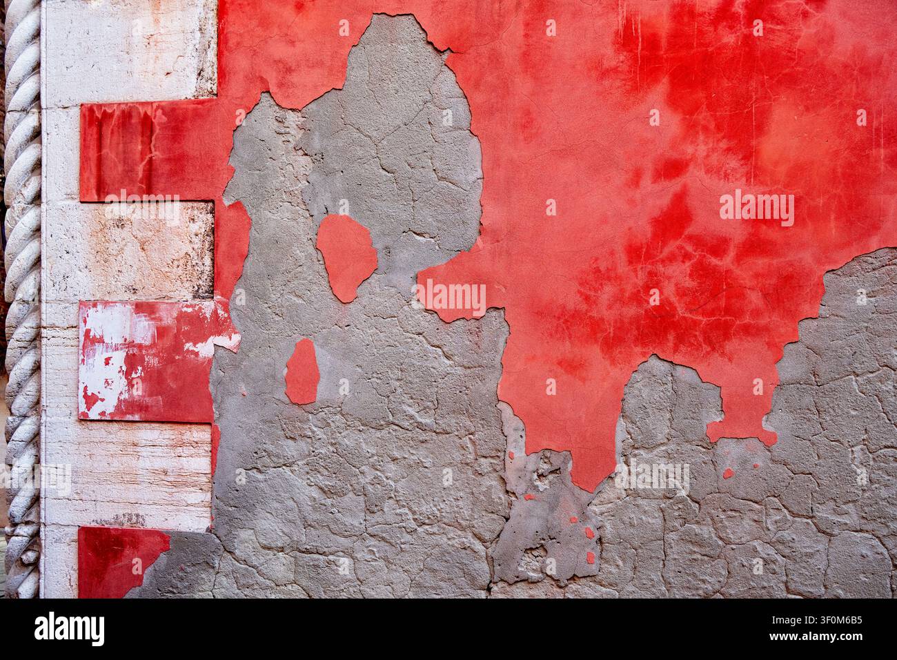 Stucco and old red paint on wall Stock Photo