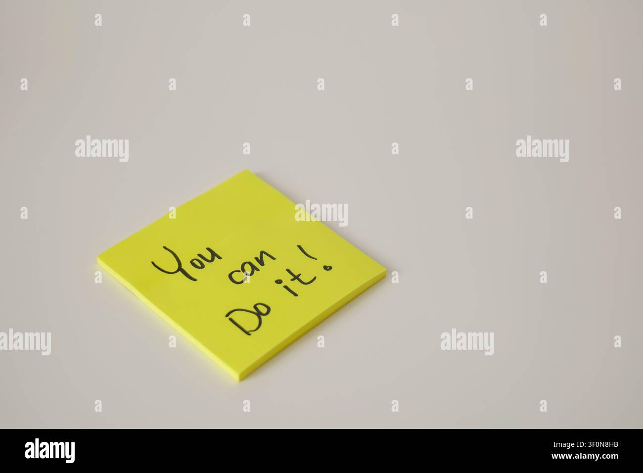 Motivational Yellow Sticky Note Isolated on White Stock Photo