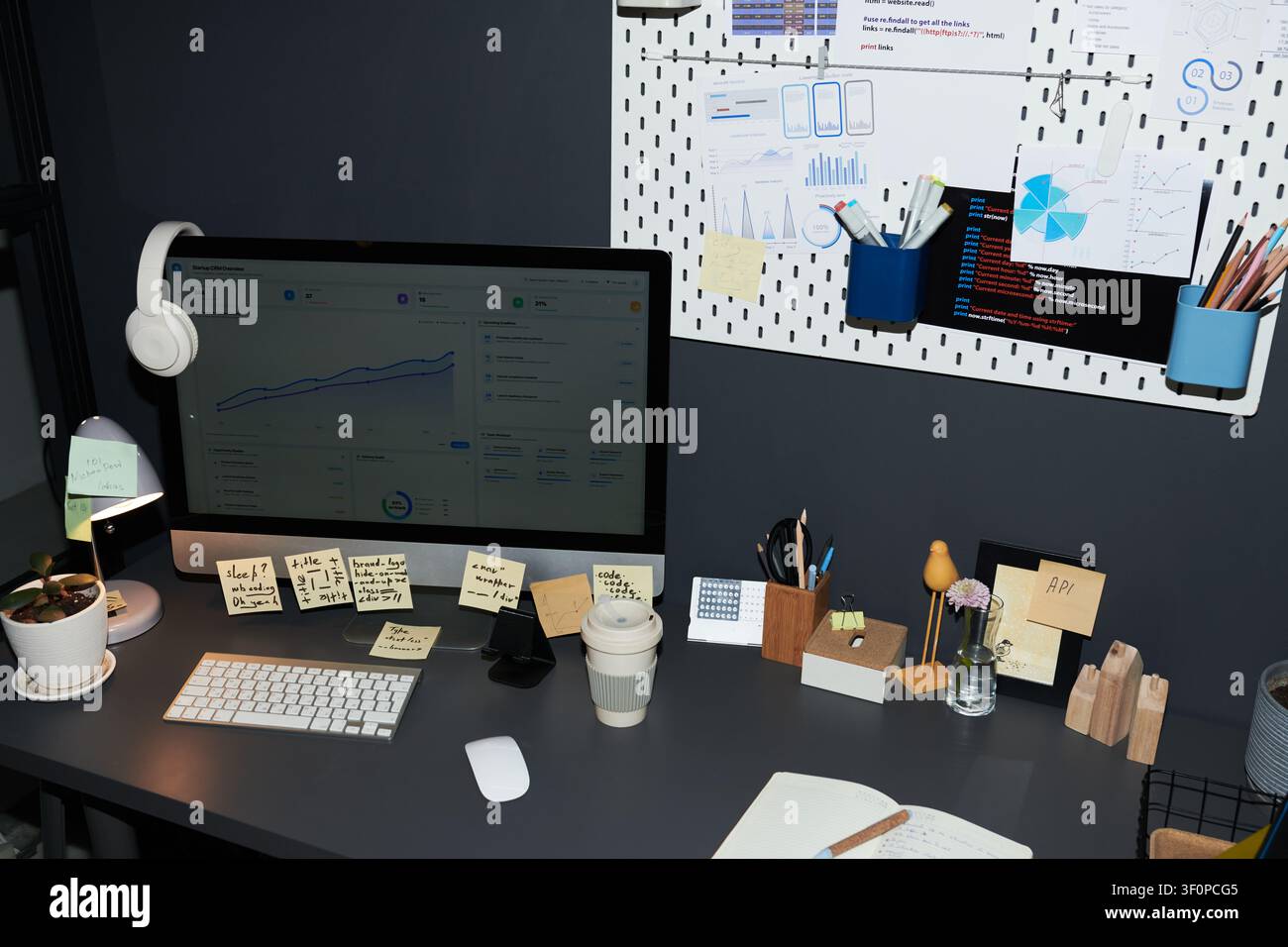 Modern Office Workspace Displaying Analytics Dashboard for Planning Stock Photo