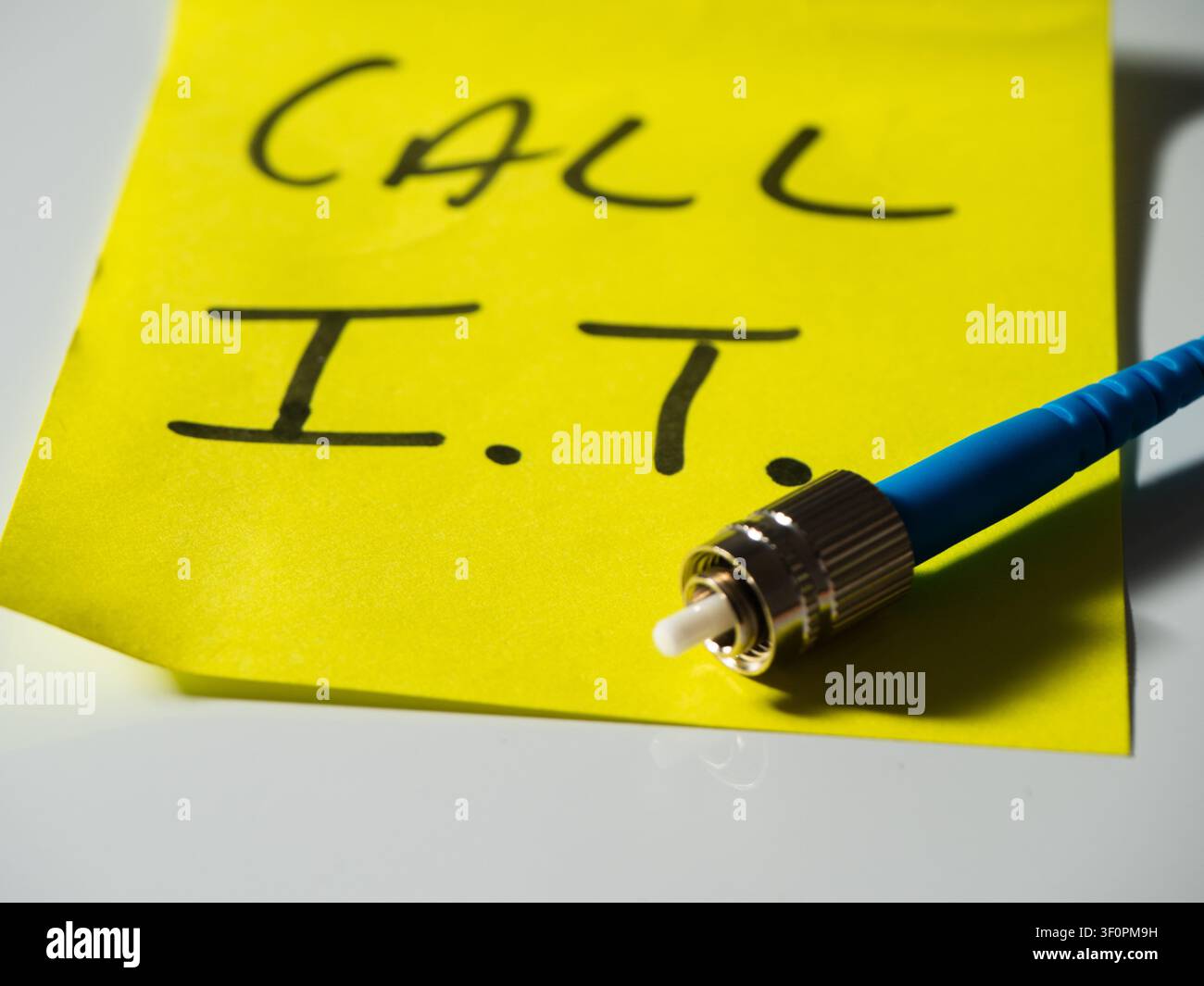 Reminder note to call network technician Stock Photo