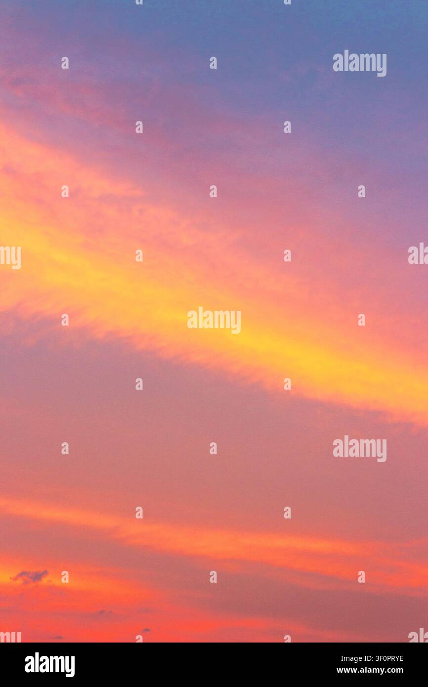 sky at sunset for background. red clouds on the blue sky. nature backdrop in evening light Stock Photo