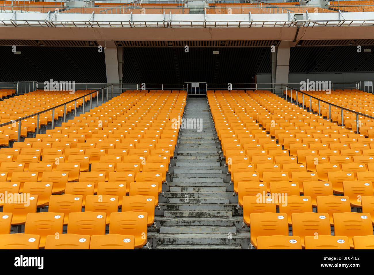 Empty stadium seats arranged in rows outdoors. Stock Photo