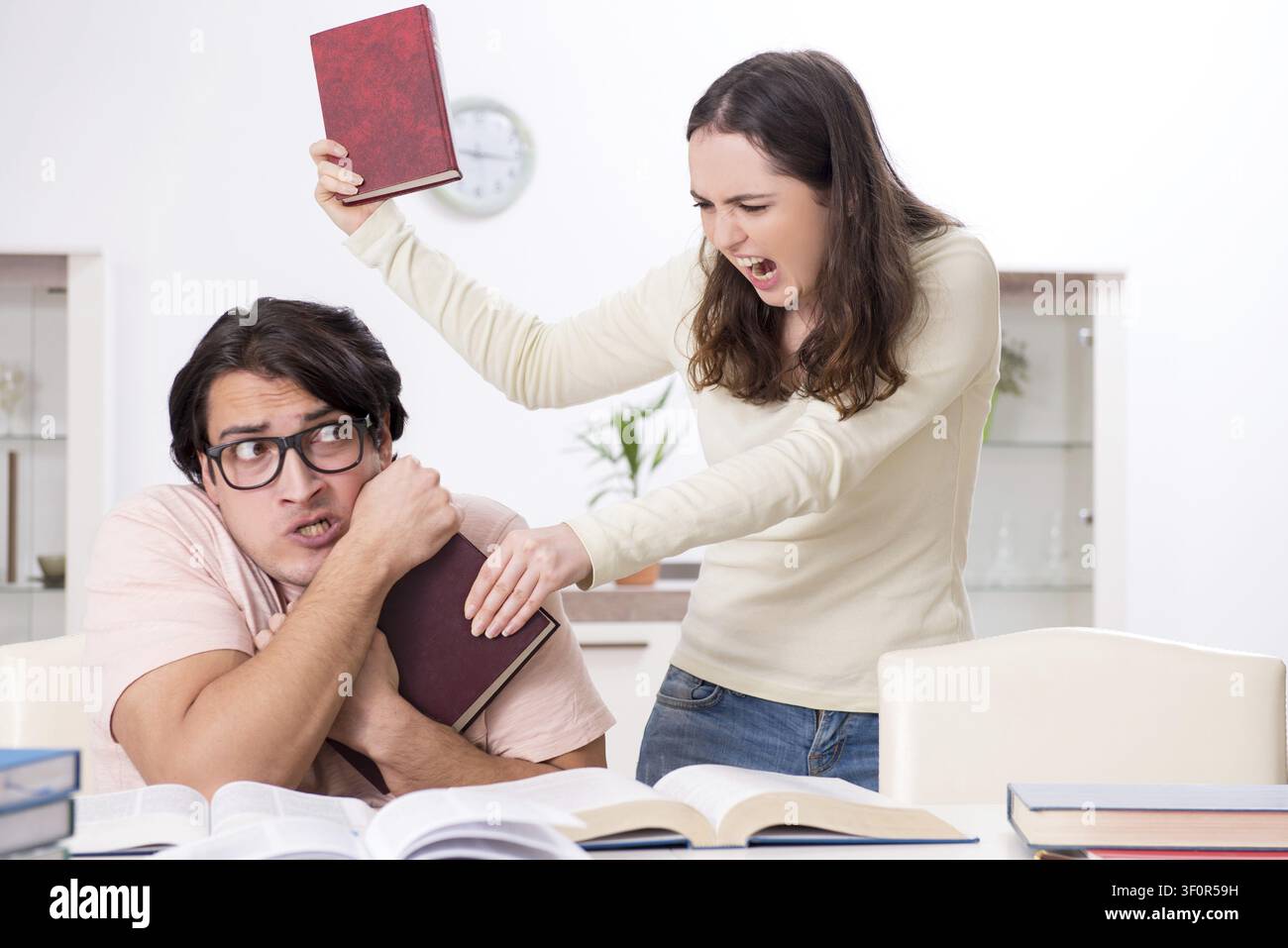 Students preparing for exam together at home Stock Photo
