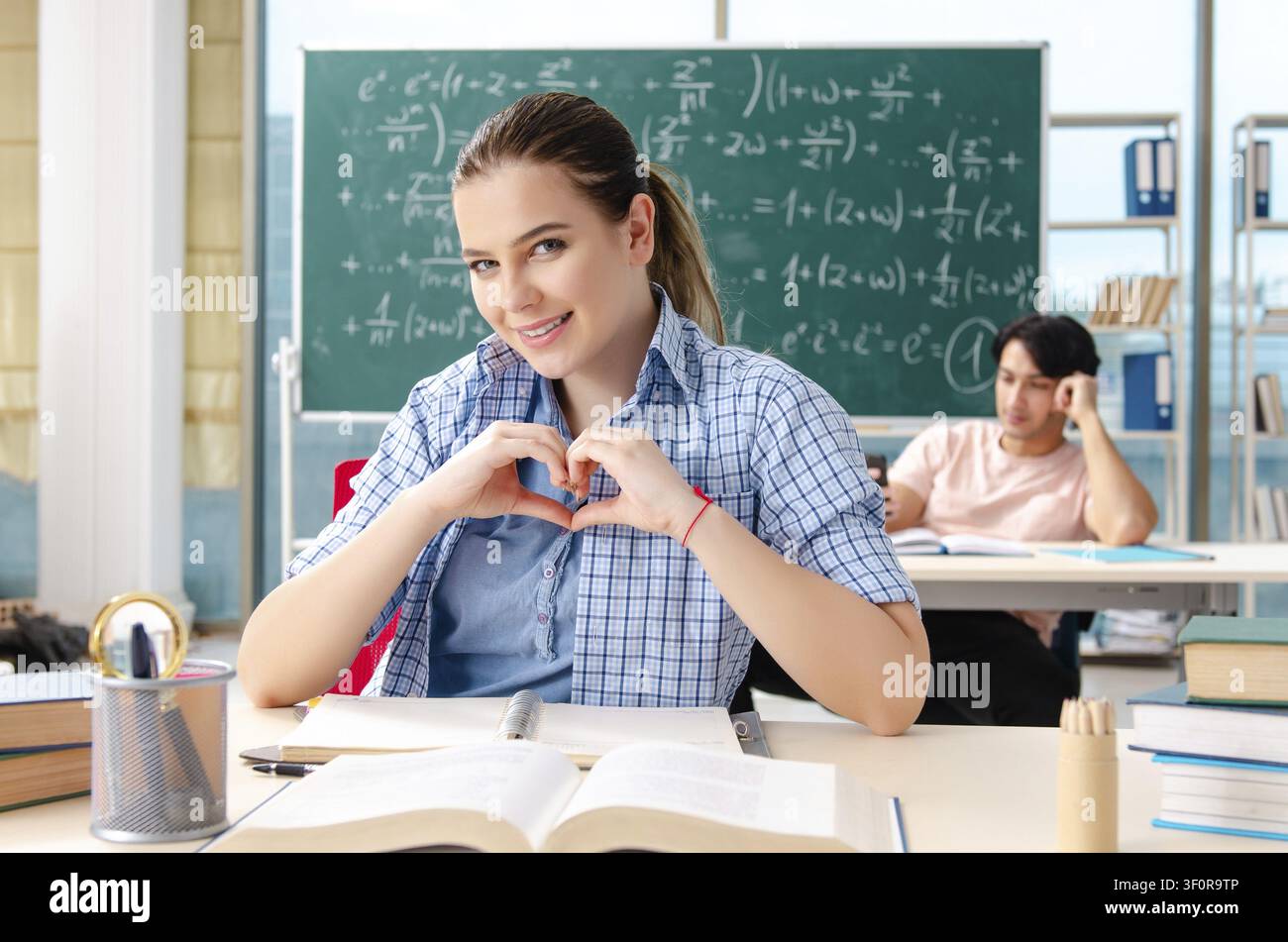 Young students taking the math exam in classroom Stock Photo