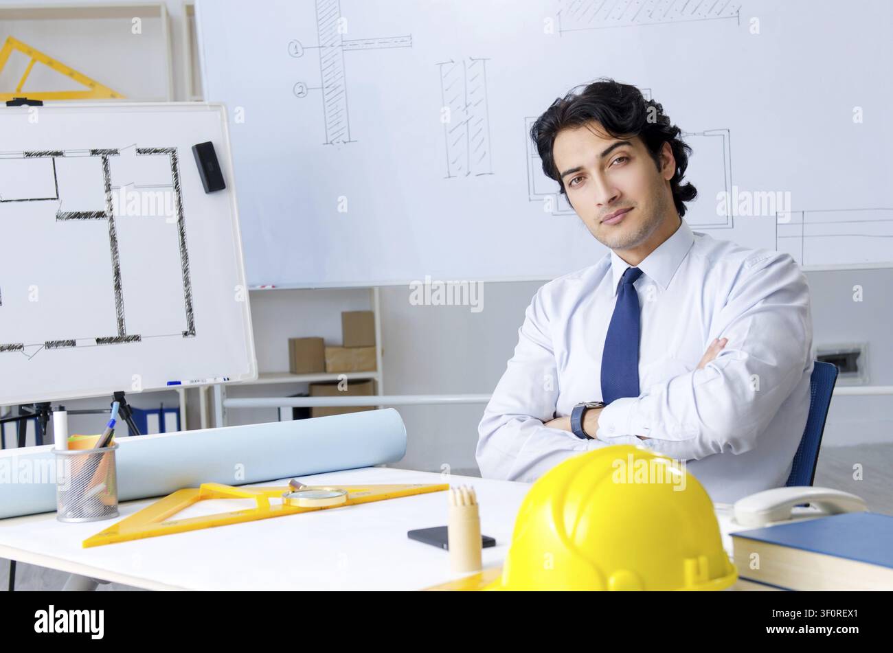 Young handsome architect working on the project Stock Photo
