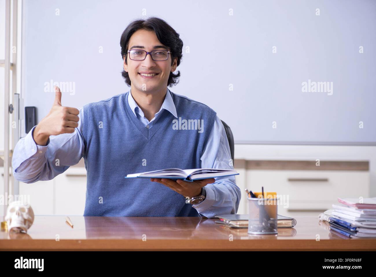 Young lecturer teacher teaching anatomy Stock Photo