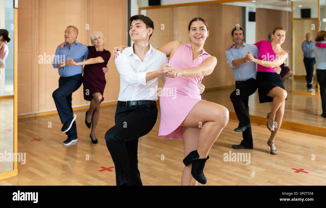Young pair practicing Latino dance in dance studio Stock Photo