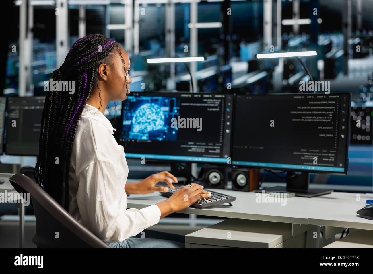 Server room admin running simulations for neural network prediction, tracking performance. Stock Photo