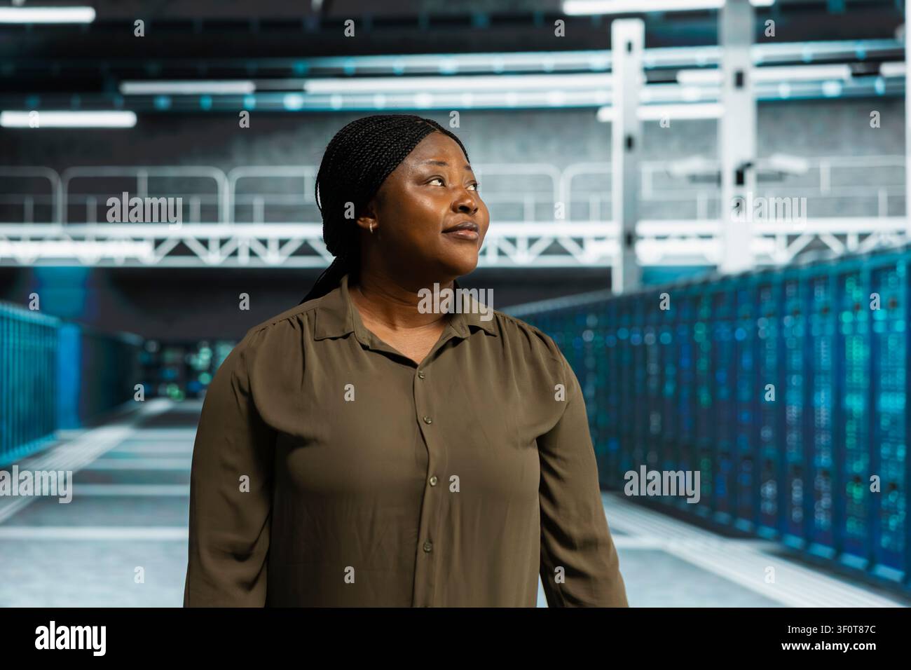 Technical specialist working in computing facility with server hardware layout supporting business technology needs with doing checkup. Stock Photo