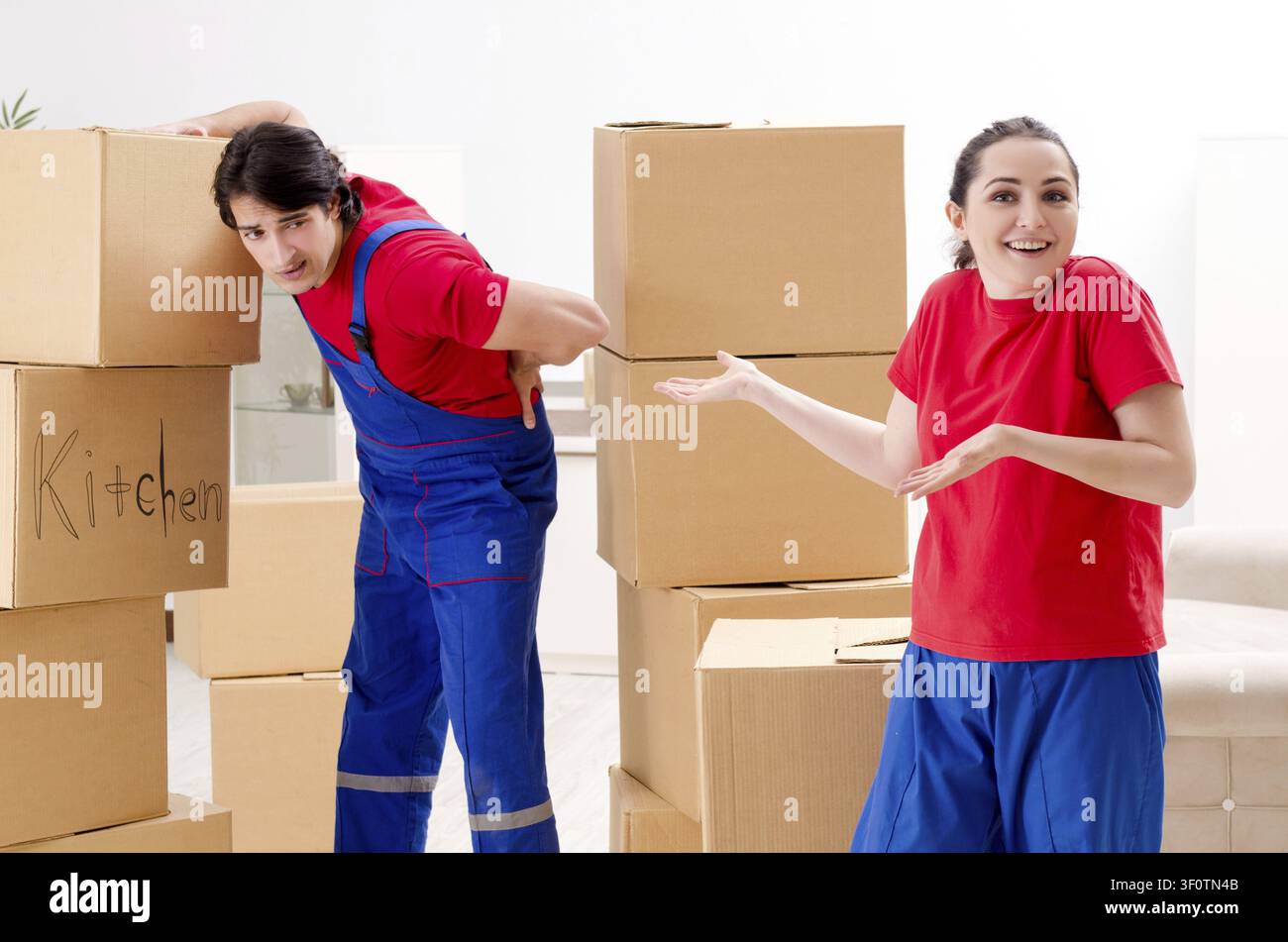 Professional movers doing home relocation Stock Photo