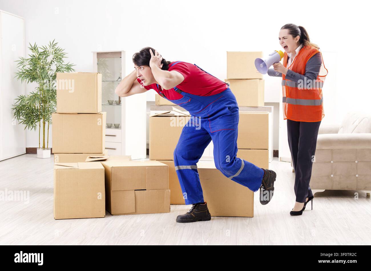 Professional movers doing home relocation Stock Photo