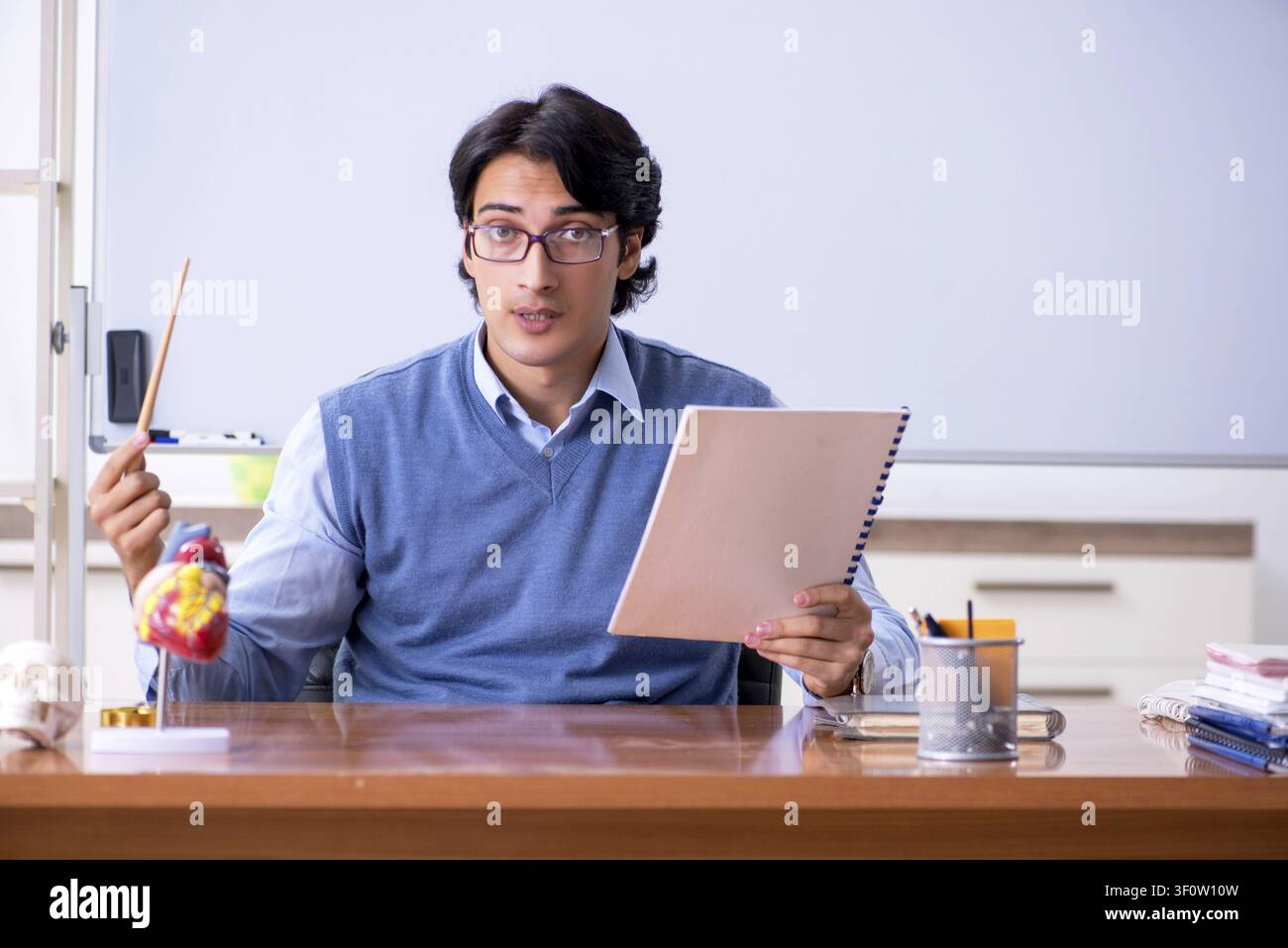 Young lecturer teacher teaching anatomy Stock Photo