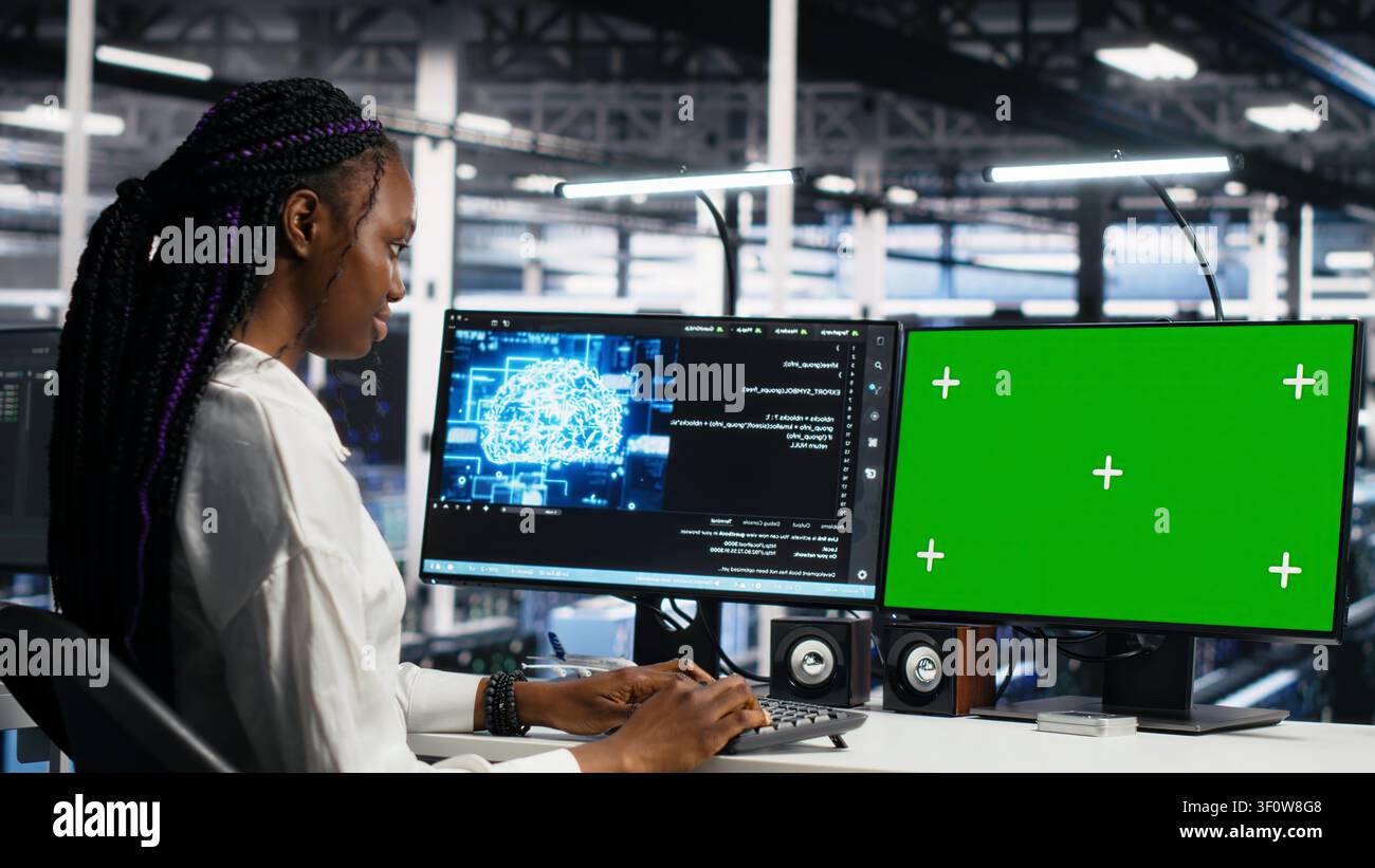 IT colleagues collaborate in a data center while reviewing AI diagnostics and infrastructure performance. Stock Photo