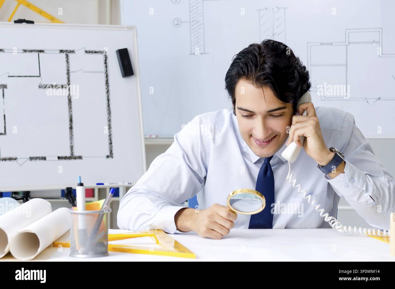 Young handsome architect working on the project Stock Photo