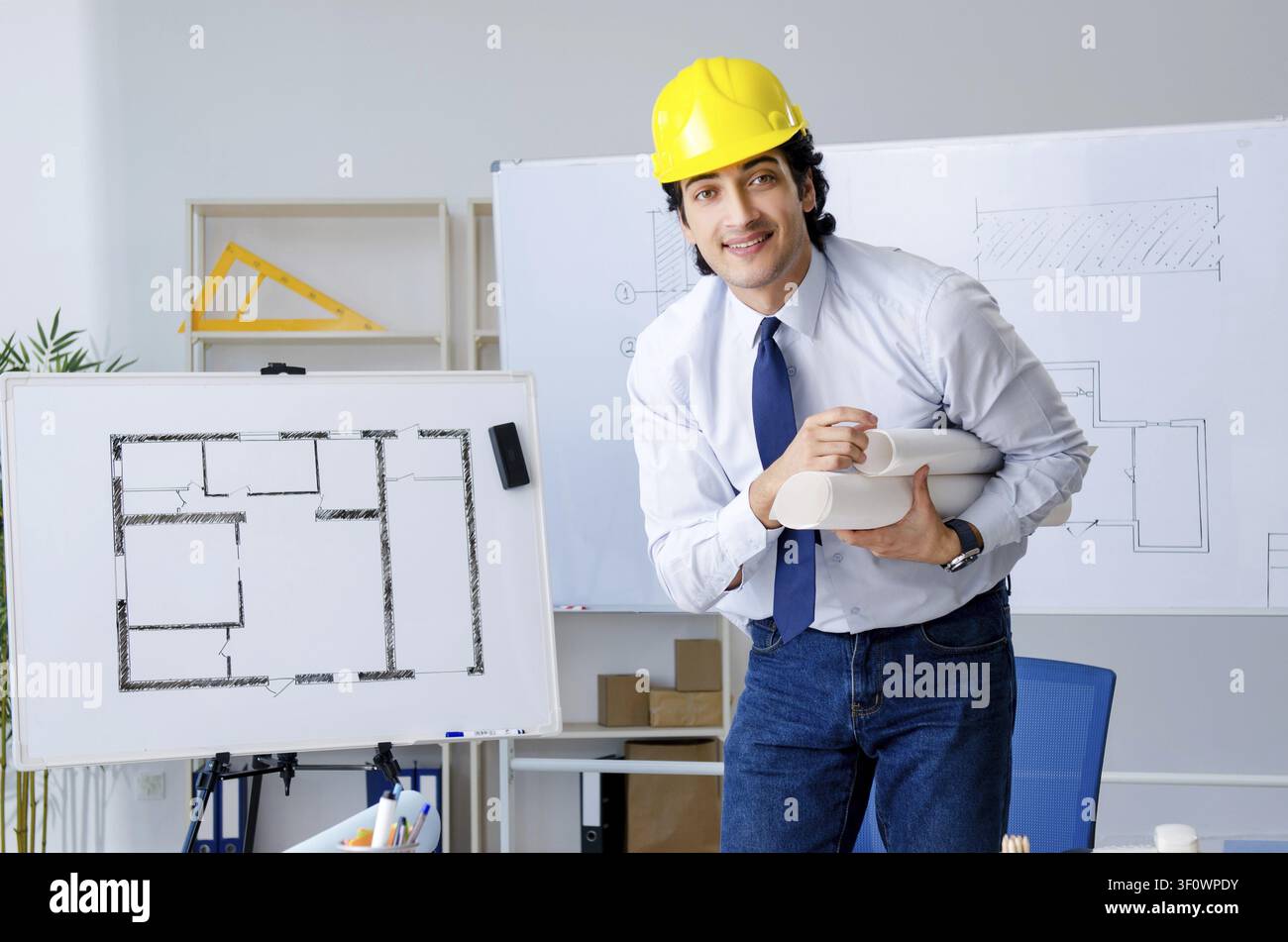 Young handsome architect working on the project Stock Photo