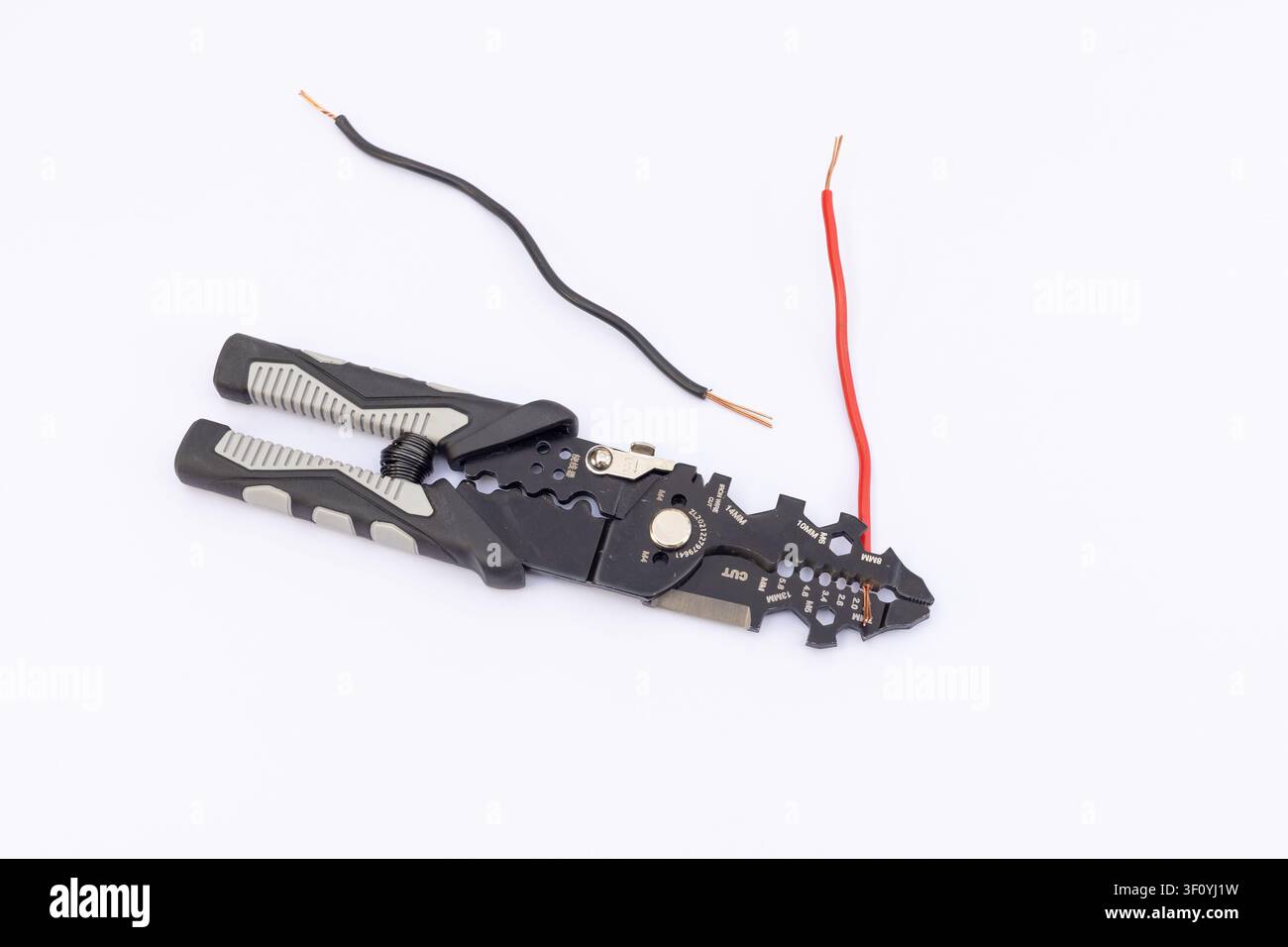 Wire Stripper Tool Stripping Red and Black Electrical Wires Stock Photo