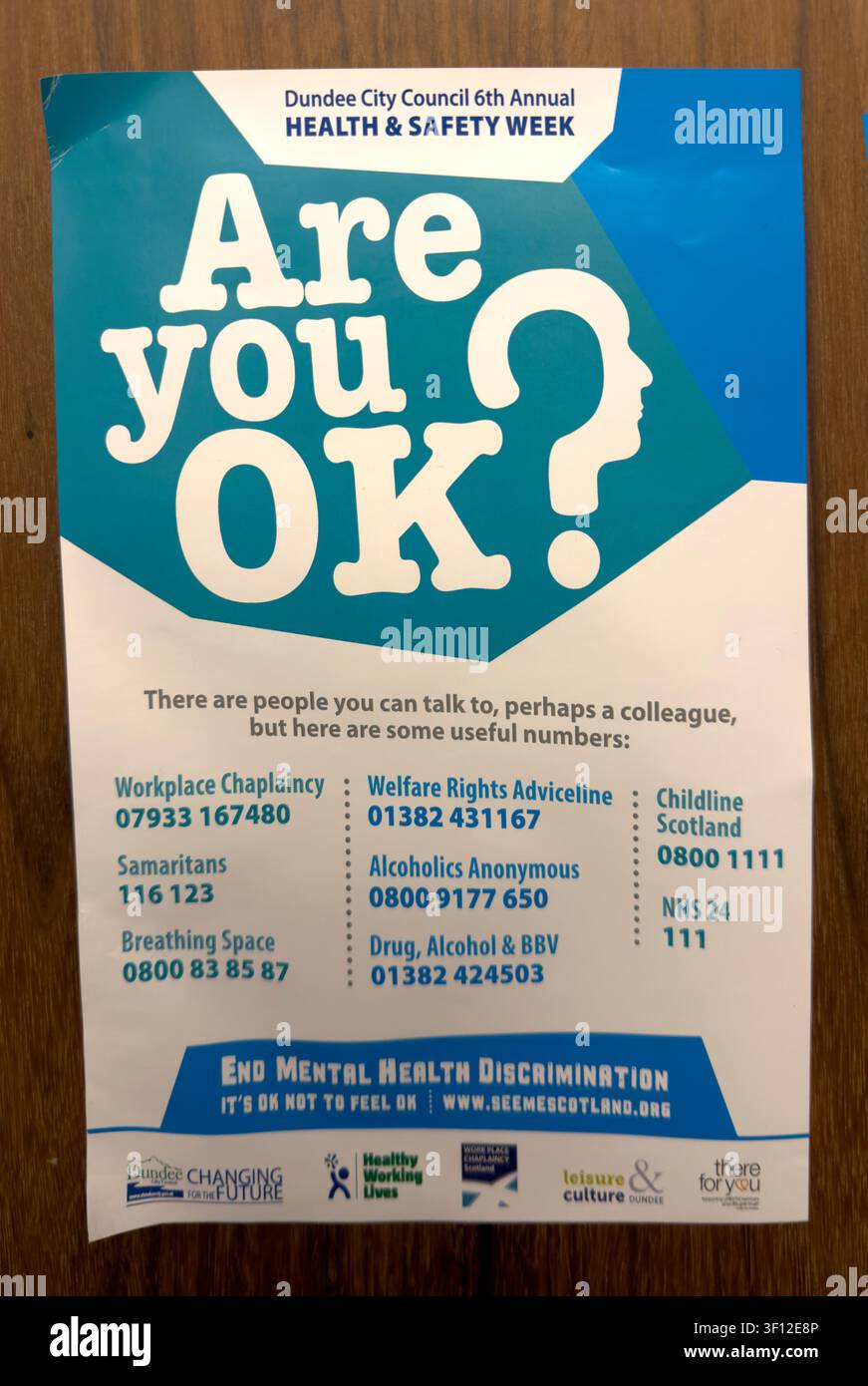 Dundee City Council Are You OK? workplace mental health poster promoting confidential support and helpline services during Health and Safety Week Stock Photo