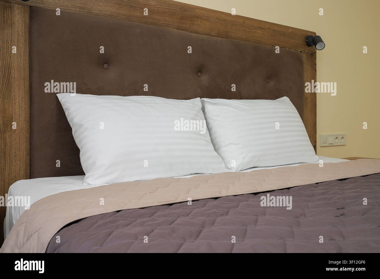 Two white pillows on hotel bed Stock Photo
