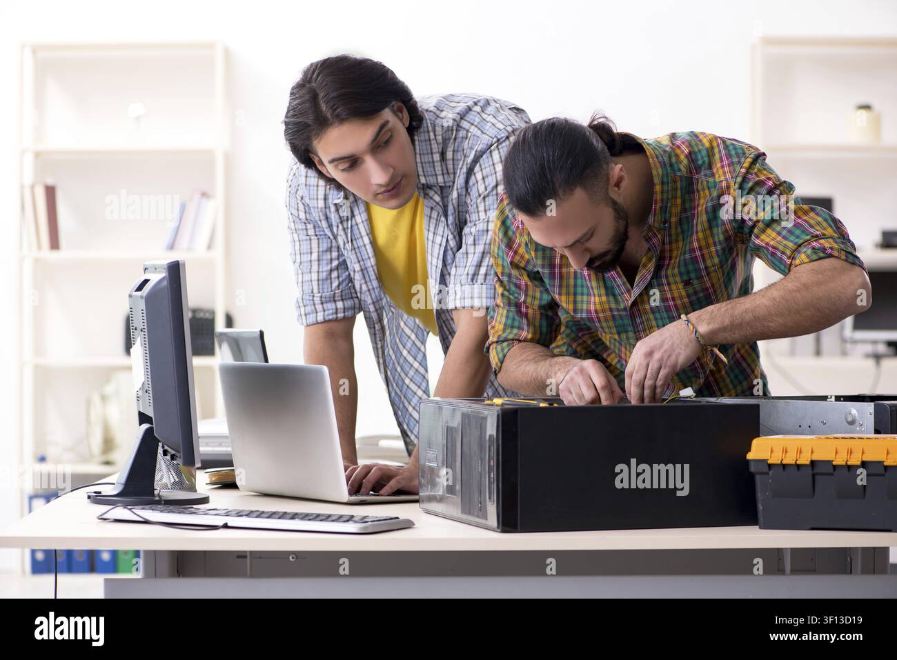 IT engineers working on hardware issue Stock Photo