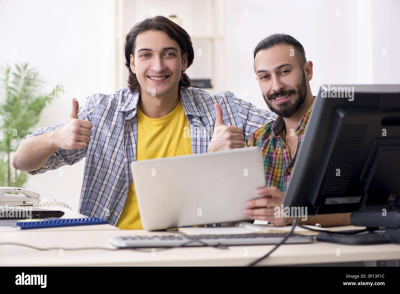 Two it specialists working in the office Stock Photo