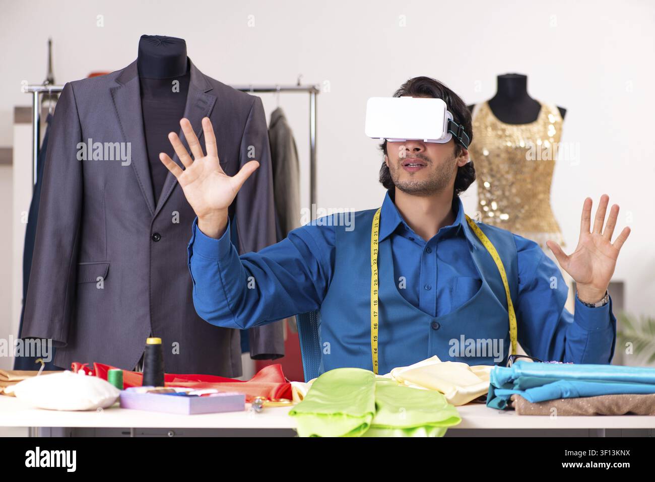 Young male tailor working at workshop Stock Photo
