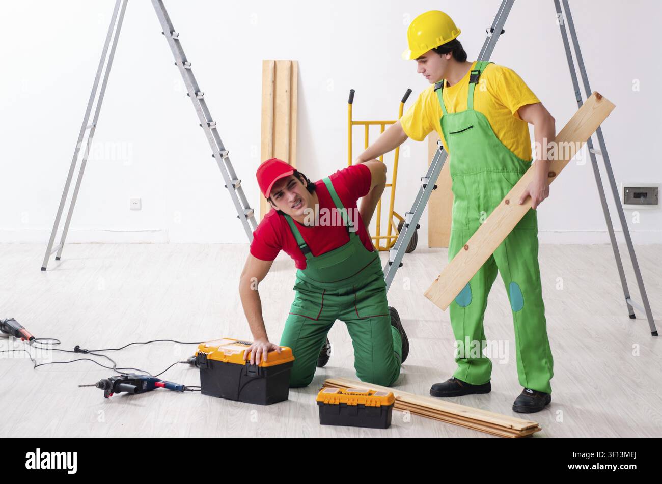 Injured worker and his workmate Stock Photo
