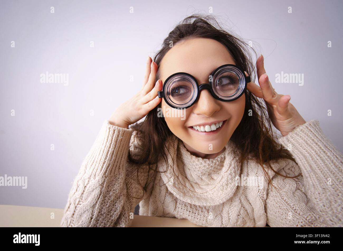 Funny nerd girl working on computer Stock Photo