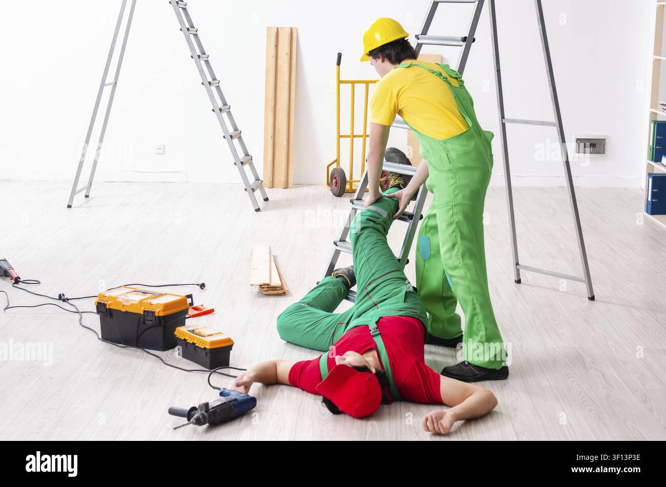 Injured worker and his workmate Stock Photo