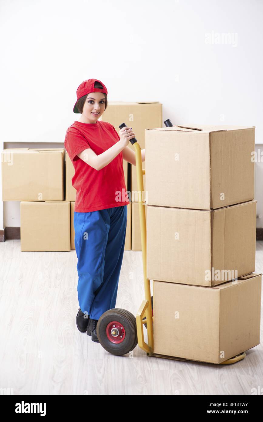 Young female professional mover doing home relocation Stock Photo