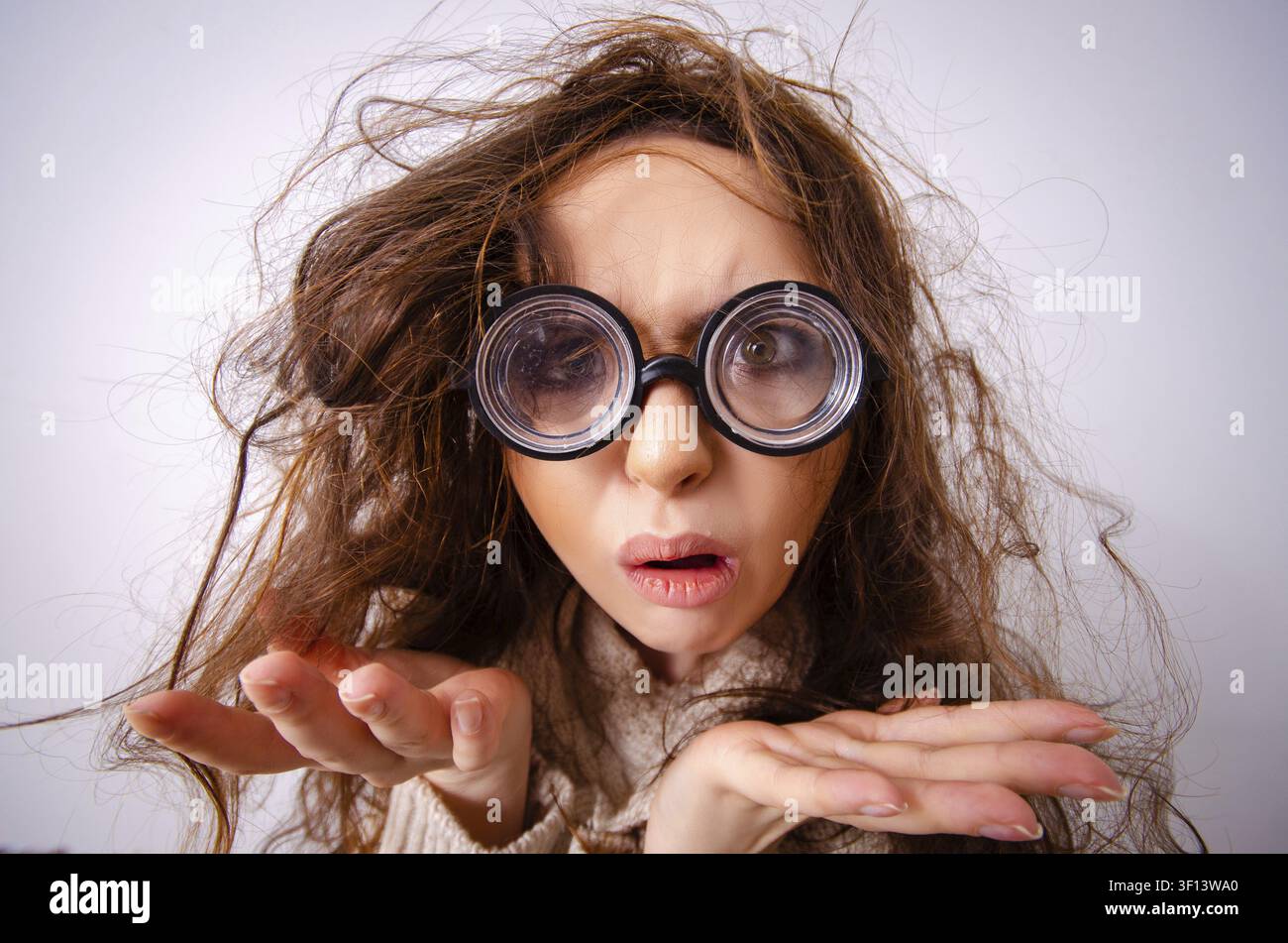 Funny nerd girl working on computer Stock Photo