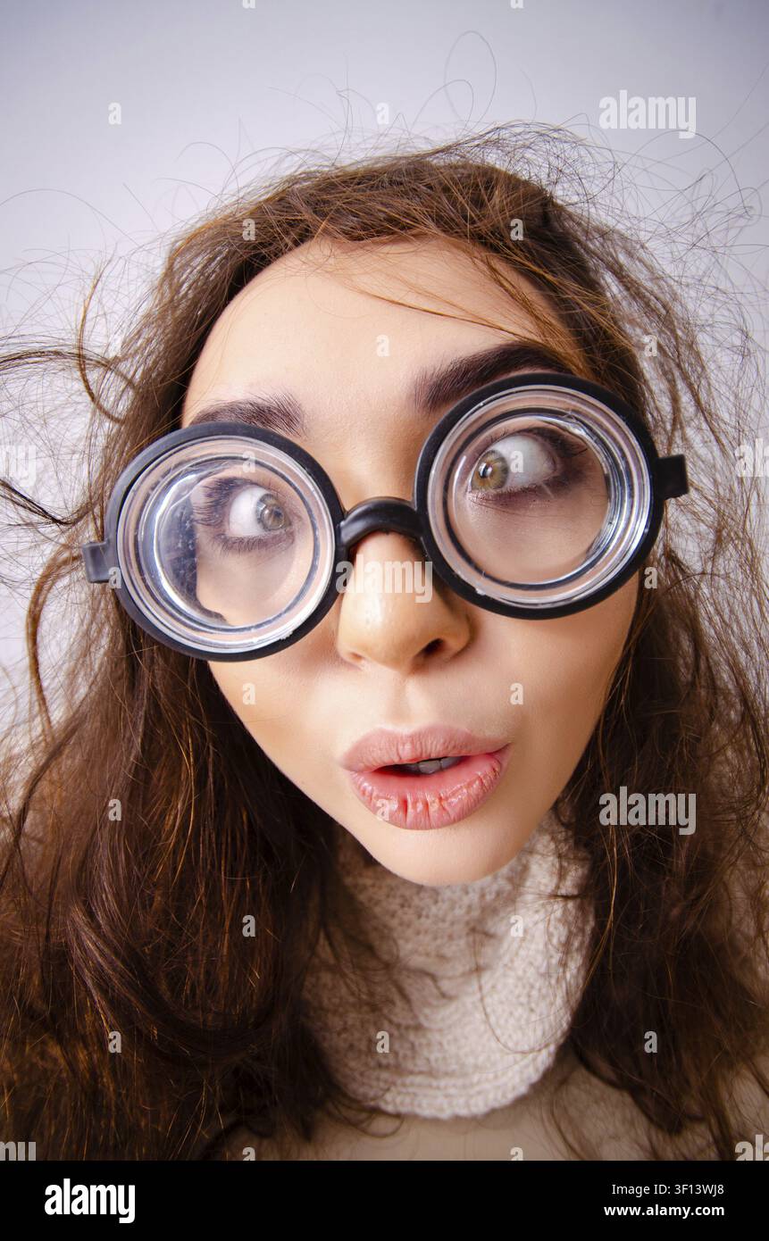 Funny nerd girl working on computer Stock Photo