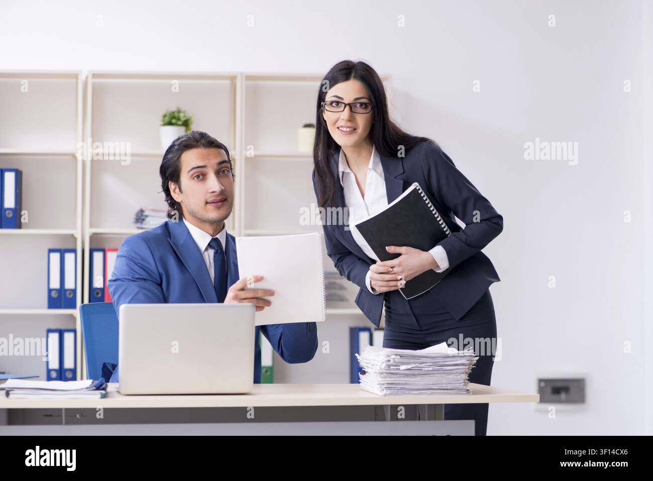 Two employees working in the office Stock Photo