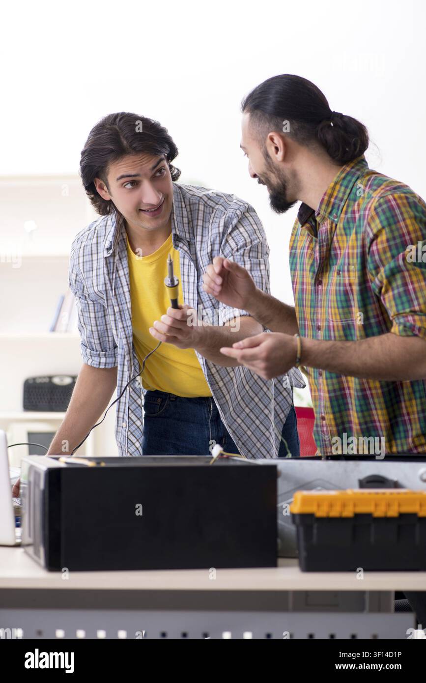 IT engineers working on hardware issue Stock Photo