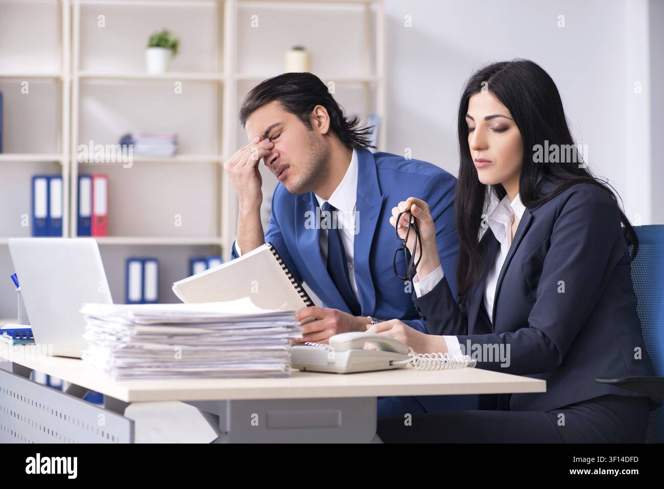 Two employees working in the office Stock Photo
