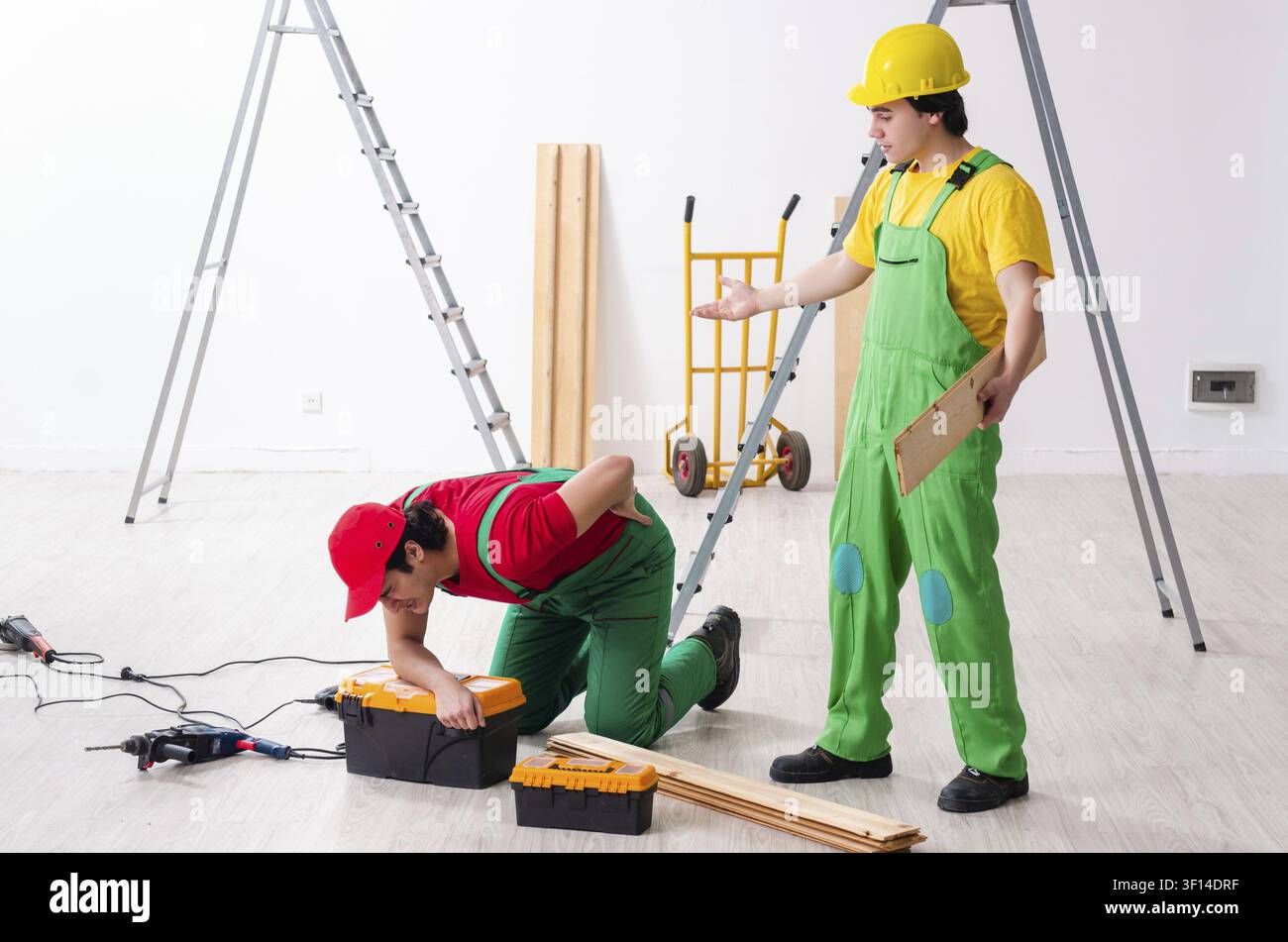 Injured worker and his workmate Stock Photo