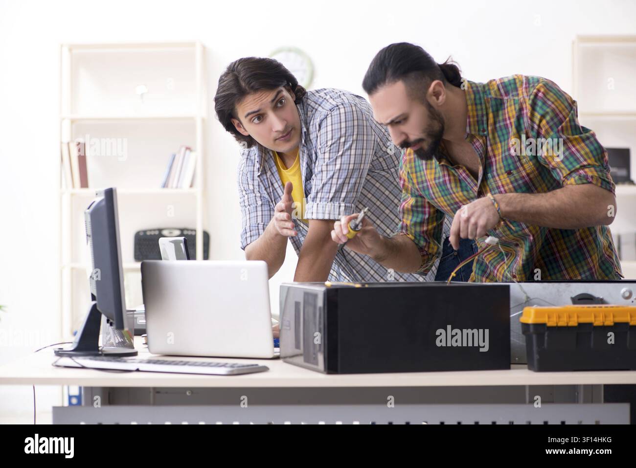 IT engineers working on hardware issue Stock Photo