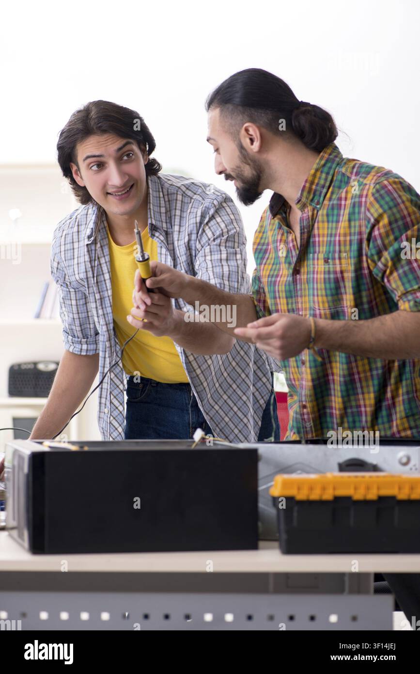 IT engineers working on hardware issue Stock Photo
