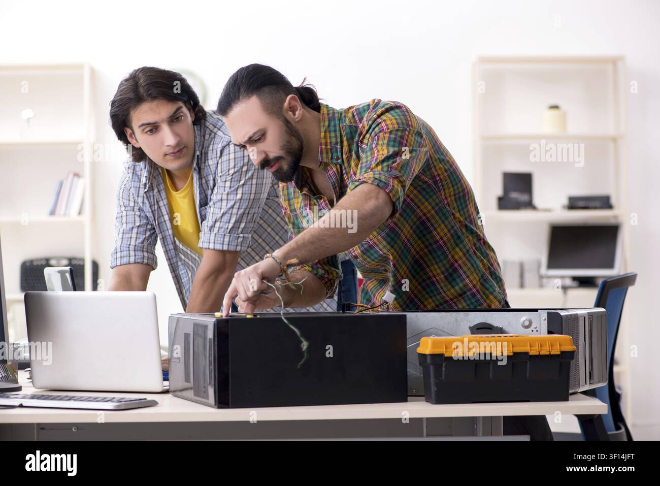 IT engineers working on hardware issue Stock Photo